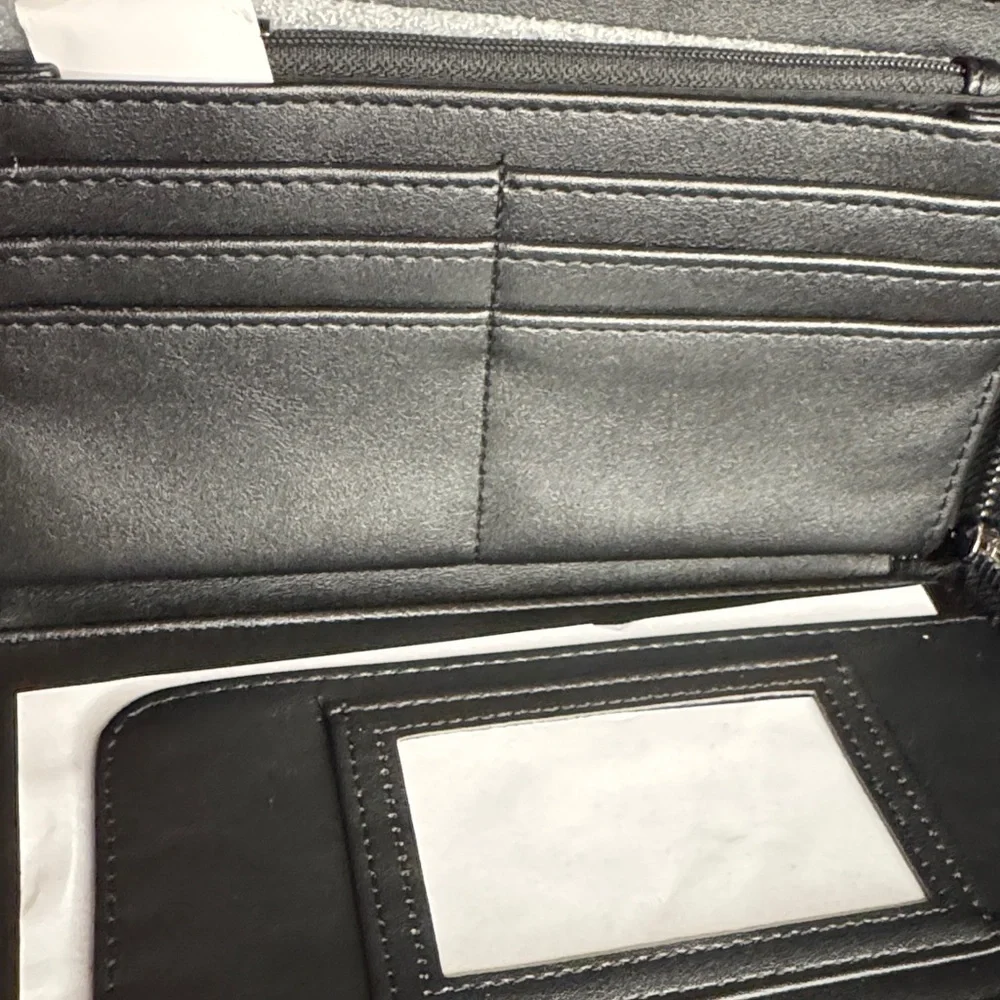 Betsey Johnson Black Embossed Wristlet with Silver Accents